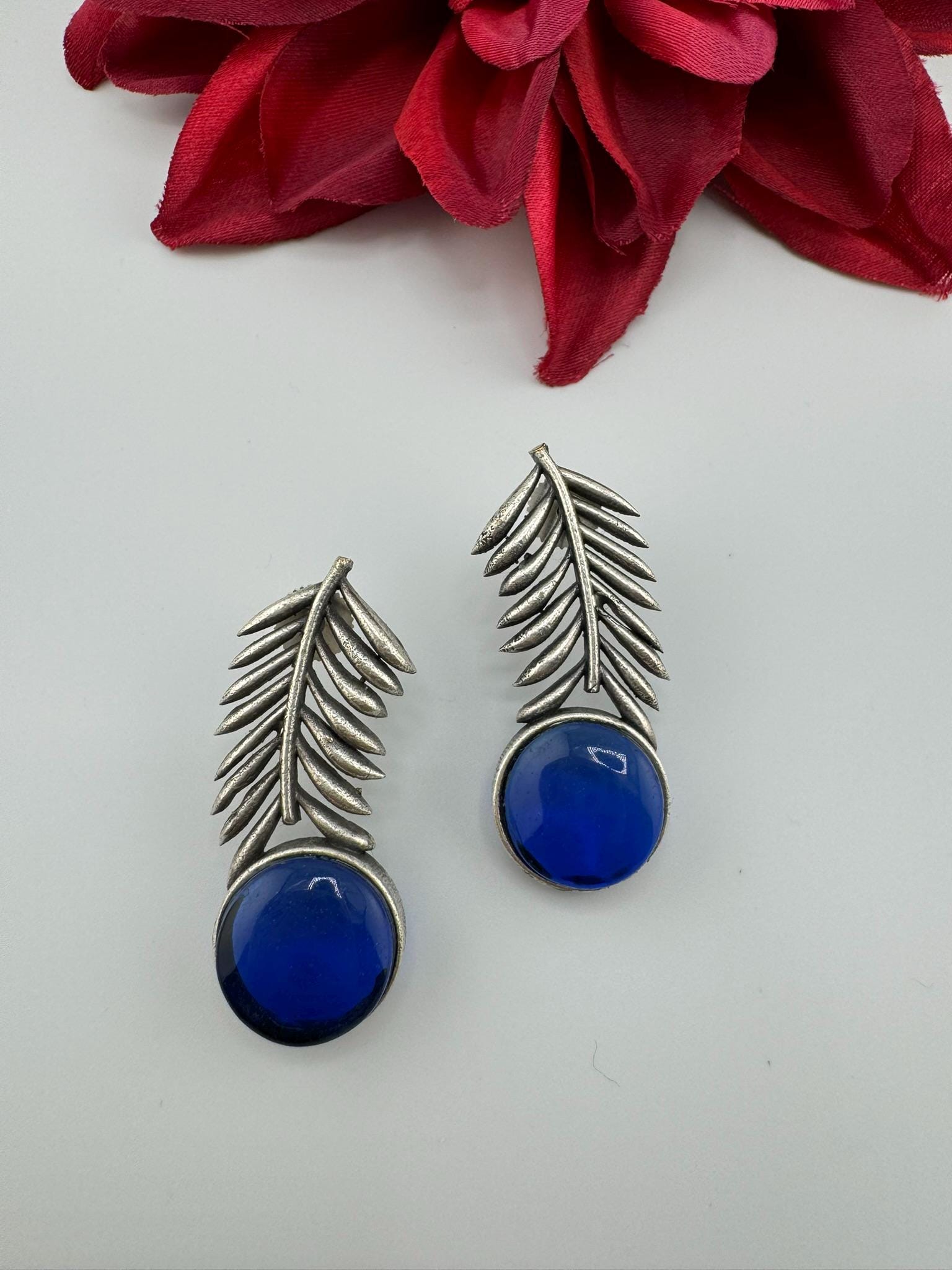 Oxidized German silver leaf pattern Stud earrings with Monalisa stone