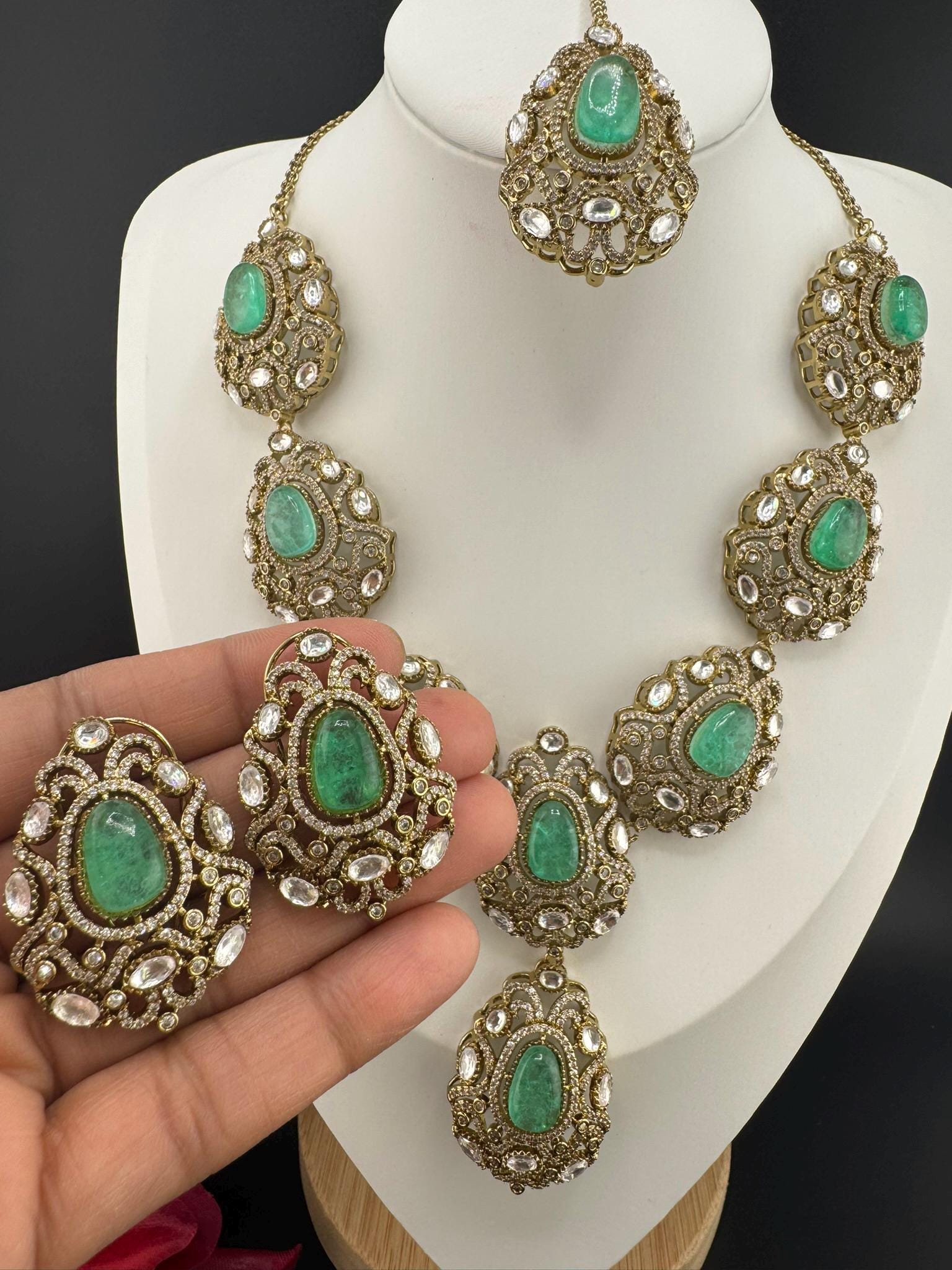 Premium Quality in Moissanite, uncut Kundan, CZ, Doublet stones in matt gold is Designer inspired fusion Necklace with Stud earring & Tikka