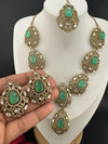 Premium Quality in Moissanite, uncut Kundan, CZ, Doublet stones in matt gold is Designer inspired fusion Necklace with Stud earring & Tikka