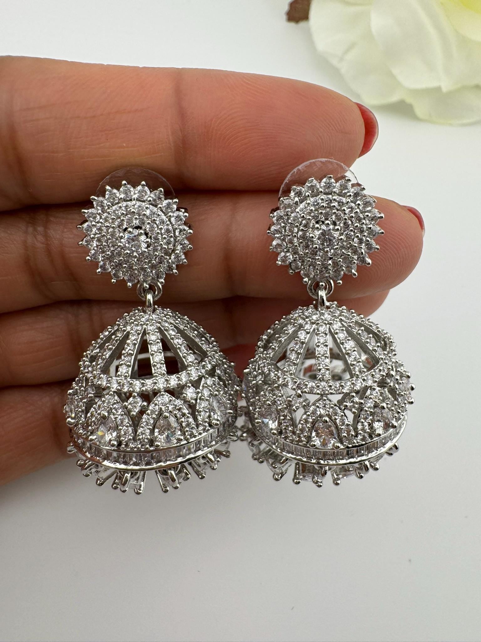 Premium Cubic Zirconia in unique setting in silver color is designer Inspired Statement Jhumka earrings/Partywear bridal/high shine/Jhumki