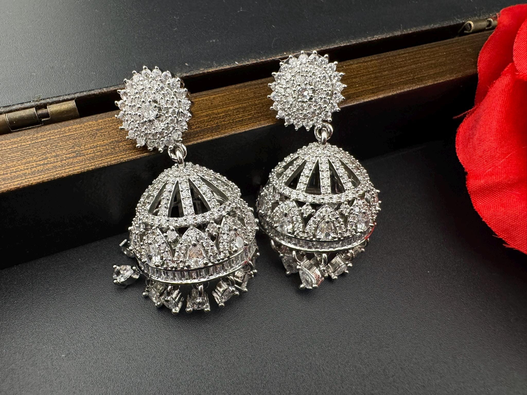 Premium Cubic Zirconia in unique setting in silver color is designer Inspired Statement Jhumka earrings/Partywear bridal/high shine/Jhumki