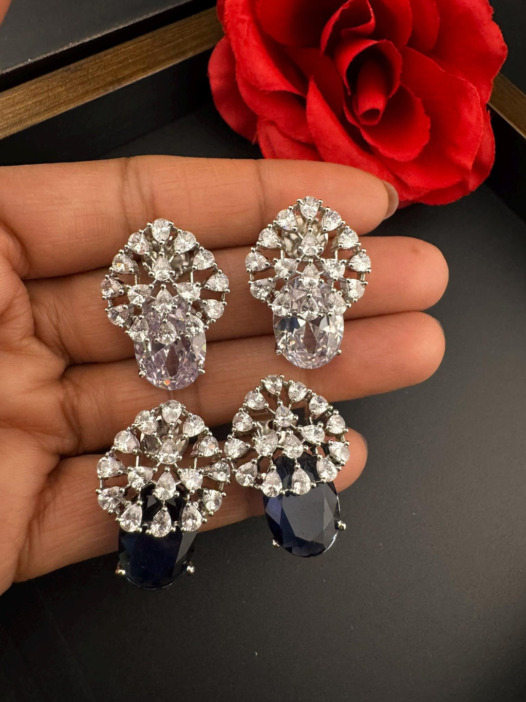 Premium Studs in Cubic Zirconia and Glass stone in silver color is designer Inspired Statement earrings