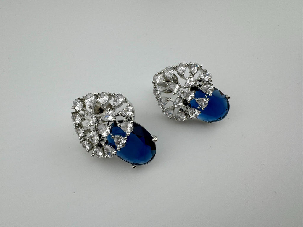 Premium Studs in Cubic Zirconia and Glass stone in silver color is designer Inspired Statement earrings
