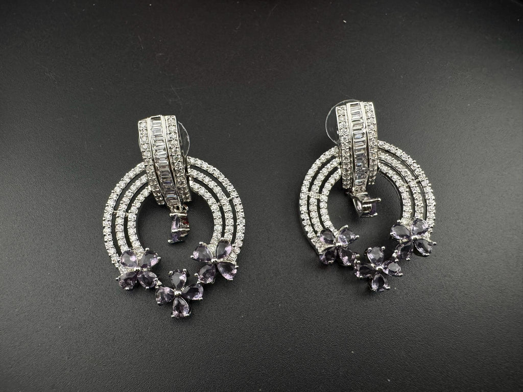 Premium earrings in Cubic Zirconia and Glass stone in silver color is designer Inspired Statement earrings