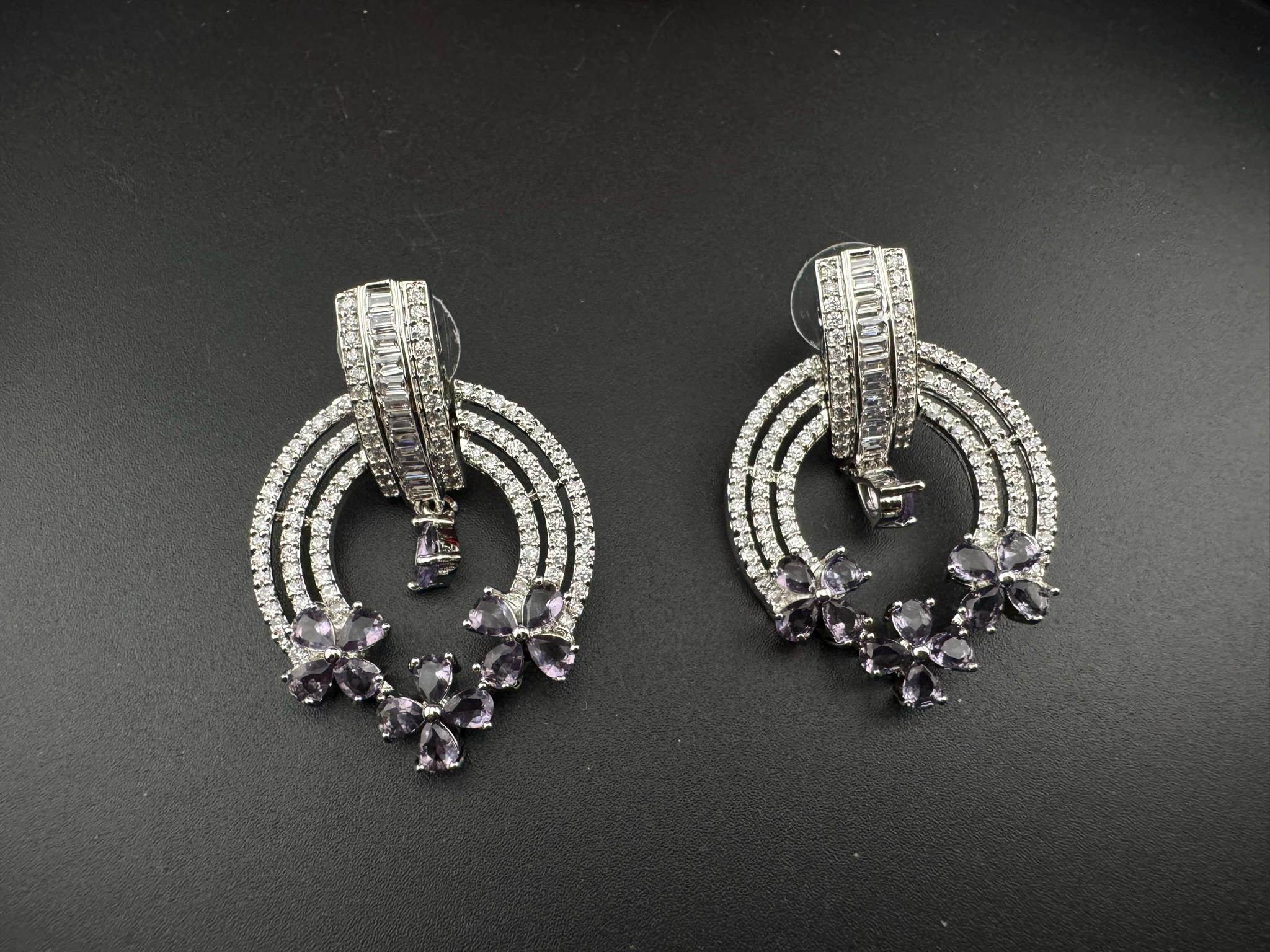 Premium Cubic Zirconia and Glass stone in silver color is designer Inspired Statement earrings/Partywear earrings/bridal/Indian/high shine