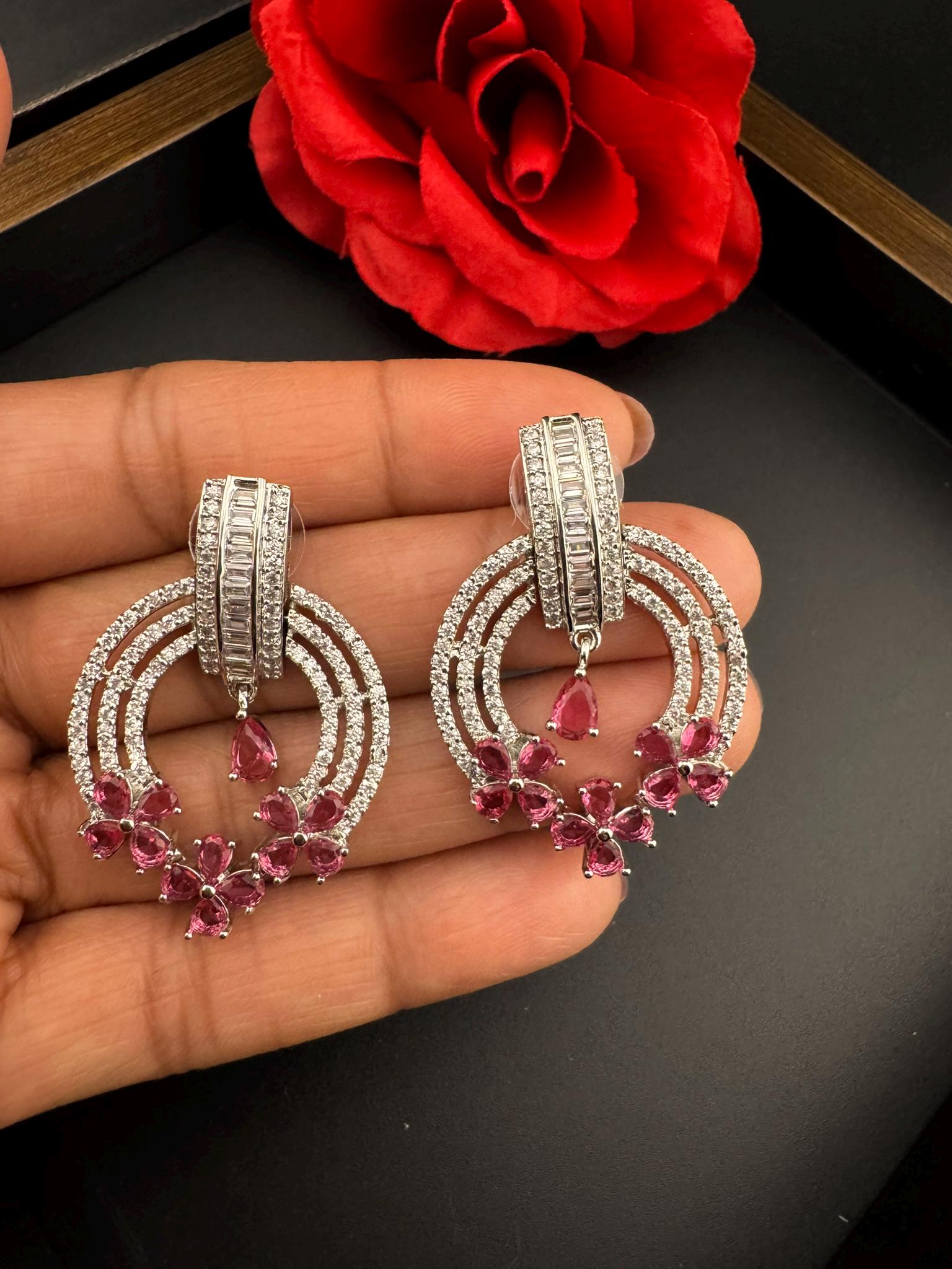 Premium Cubic Zirconia and Glass stone in silver color is designer Inspired Statement earrings/Partywear earrings/bridal/Indian/high shine