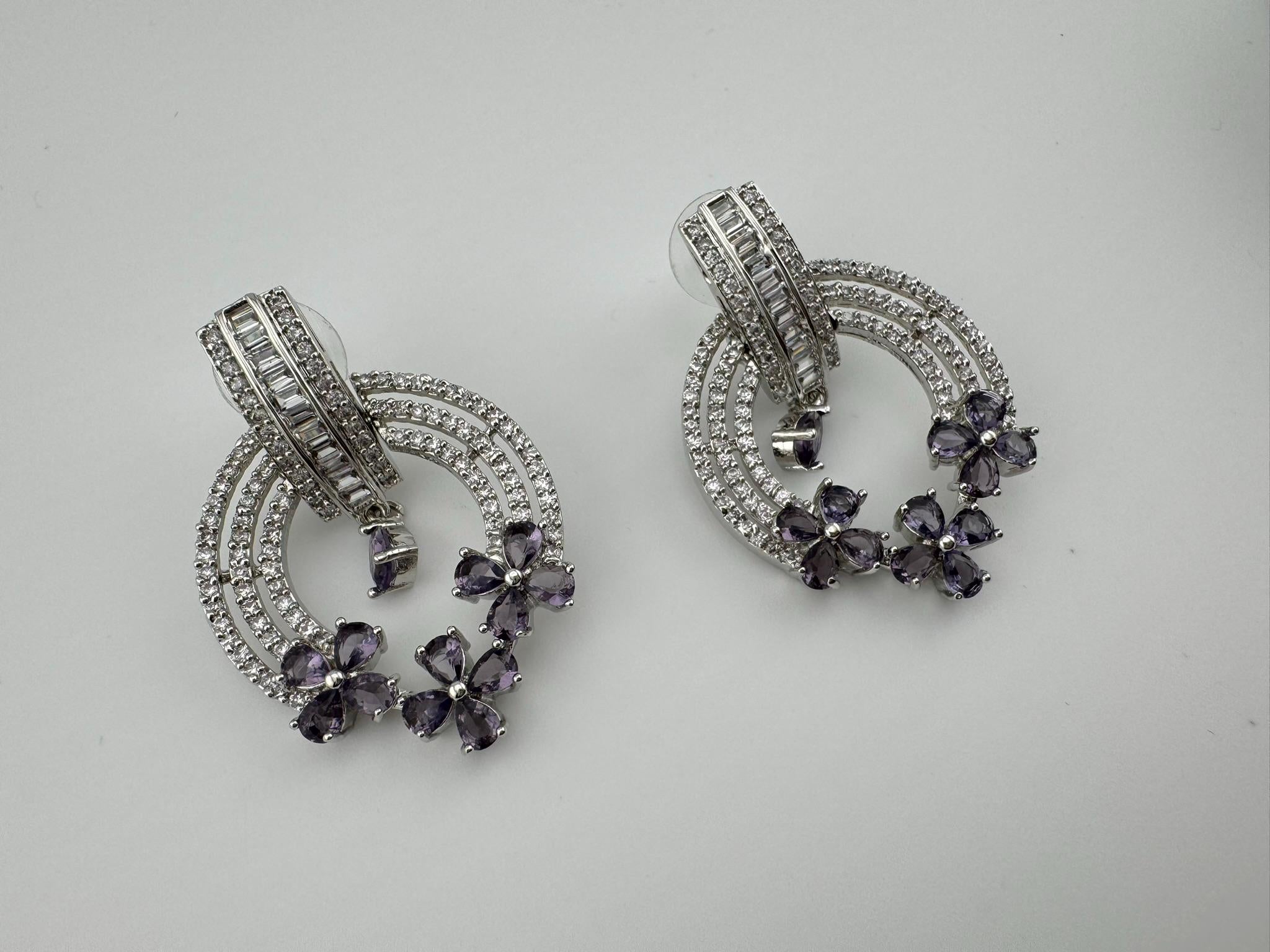 Premium earrings in Cubic Zirconia and Glass stone in silver color is designer Inspired Statement earrings