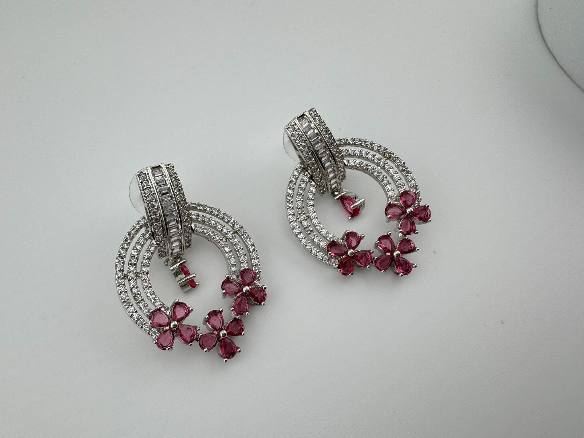 Premium earrings in Cubic Zirconia and Glass stone in silver color is designer Inspired Statement earrings