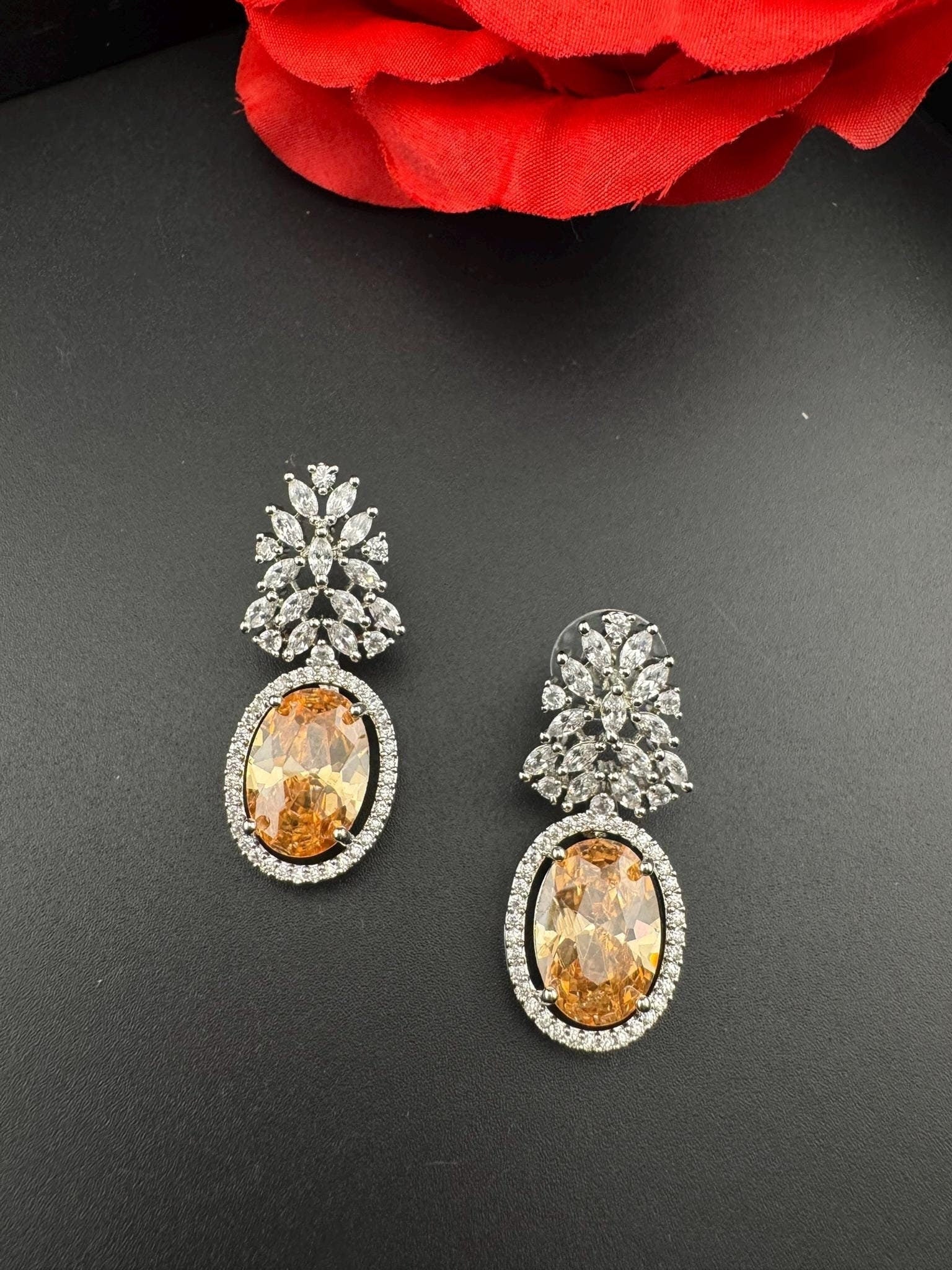 Premium Cubic Zirconia and Crystal stone in silver color is designer Inspired Statement earrings/Partywear earrings/bridal/Indian/high shine