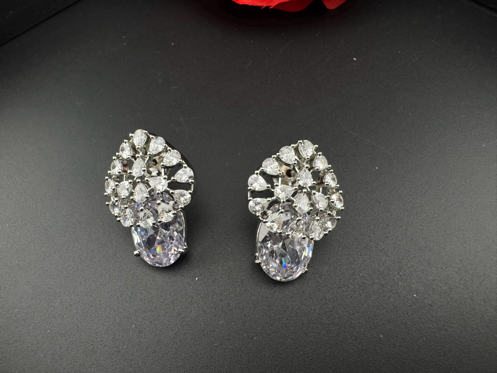 Premium Cubic Zirconia and Glass stone in silver color is designer Inspired Statement earrings/Partywear earrings/bridal/Indian/unique Studs