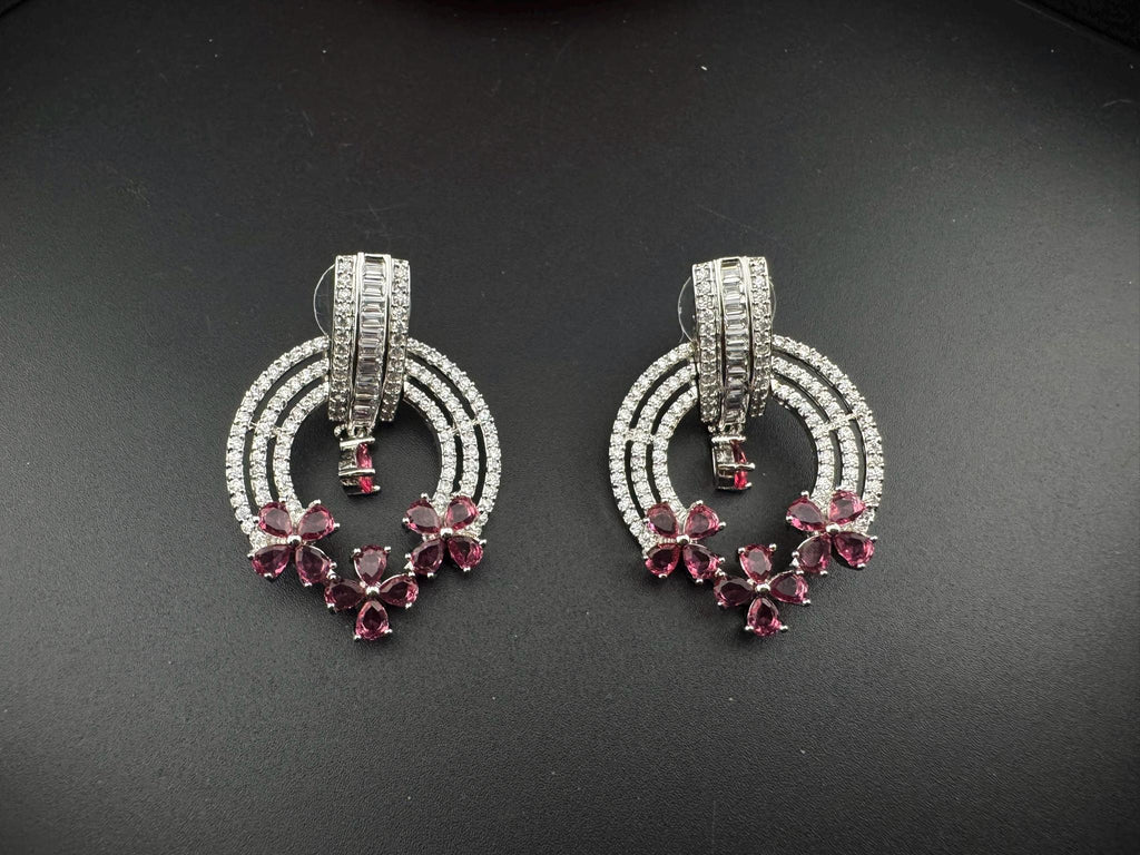 Premium earrings in Cubic Zirconia and Glass stone in silver color is designer Inspired Statement earrings