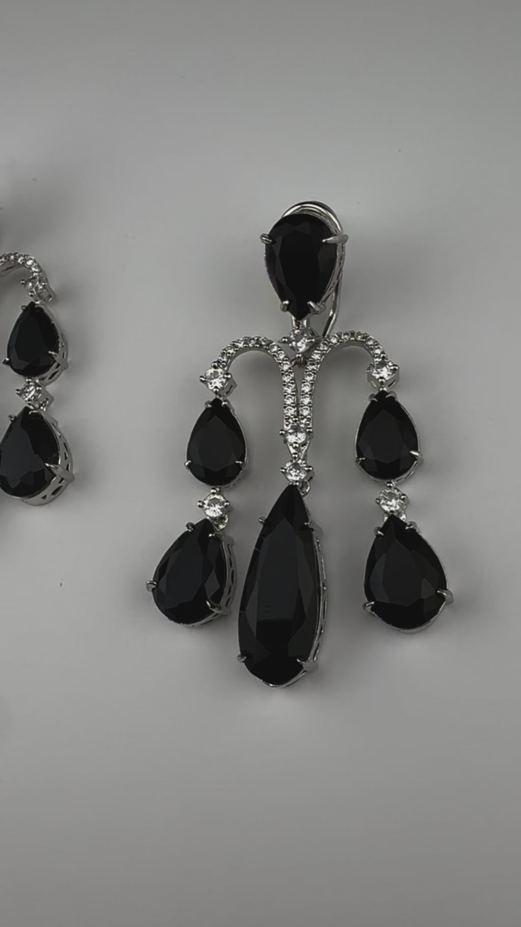 Premium Cubic Zirconia and glass stone in silver color is designer Inspired Statement Long earrings